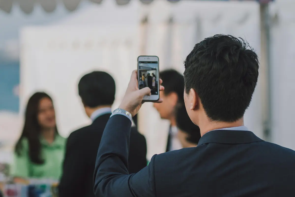 A man filming other people